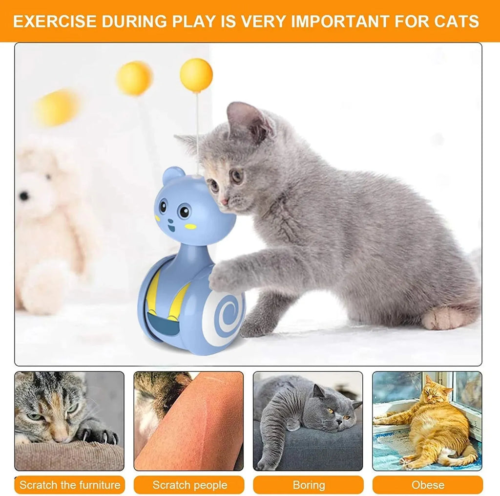 Pink and blue interactive cat toy with feather wand and rotating ball on bumbler base