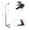Black mobile phone bed bracket mounted beside bed frame holding smartphone