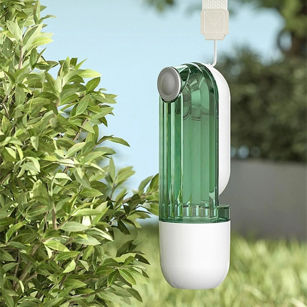 Foldable beige dog water bottle with food dispenser tray extended for drinking outdoors
