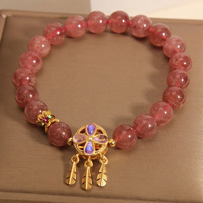 Women's strawberry quartz bracelet with four-leaf dream catcher ball pendant, original crystal jewellery design