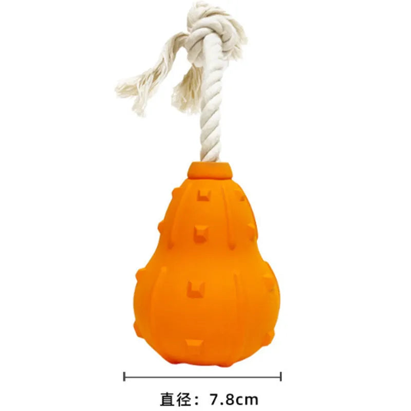 Natural rubber stuffable dog toy for small medium breeds, shown with treat filling and longer strap.