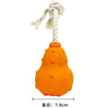 Natural rubber stuffable dog toy for small medium breeds, shown with treat filling and longer strap.