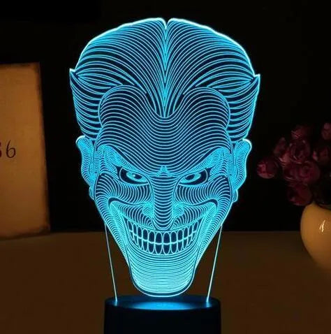 USB-powered 3D acrylic LED lamp showing multiple colour options on a desk
