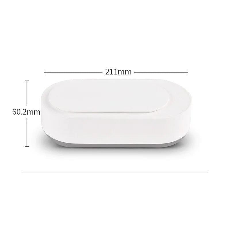 White portable ultrasonic cleaner with digital display and stainless steel cleaning tank.