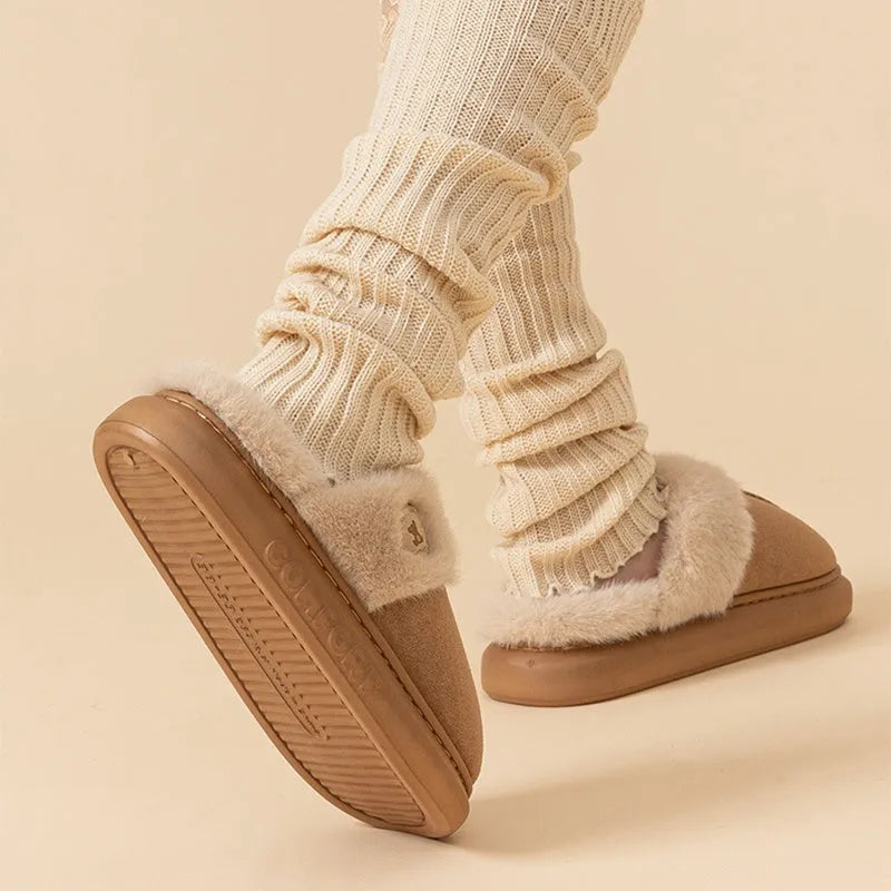 Plush fleece slipper with thick PVC sole and car stitching, shown in blue colour.