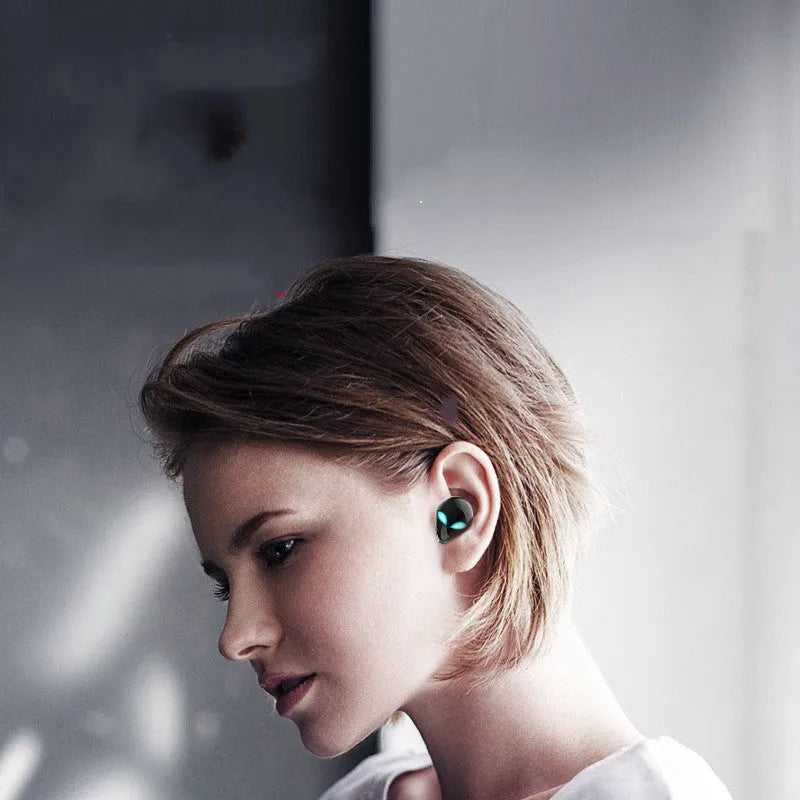 Starman T8 alien-inspired Bluetooth headset with LED lights in charging case.