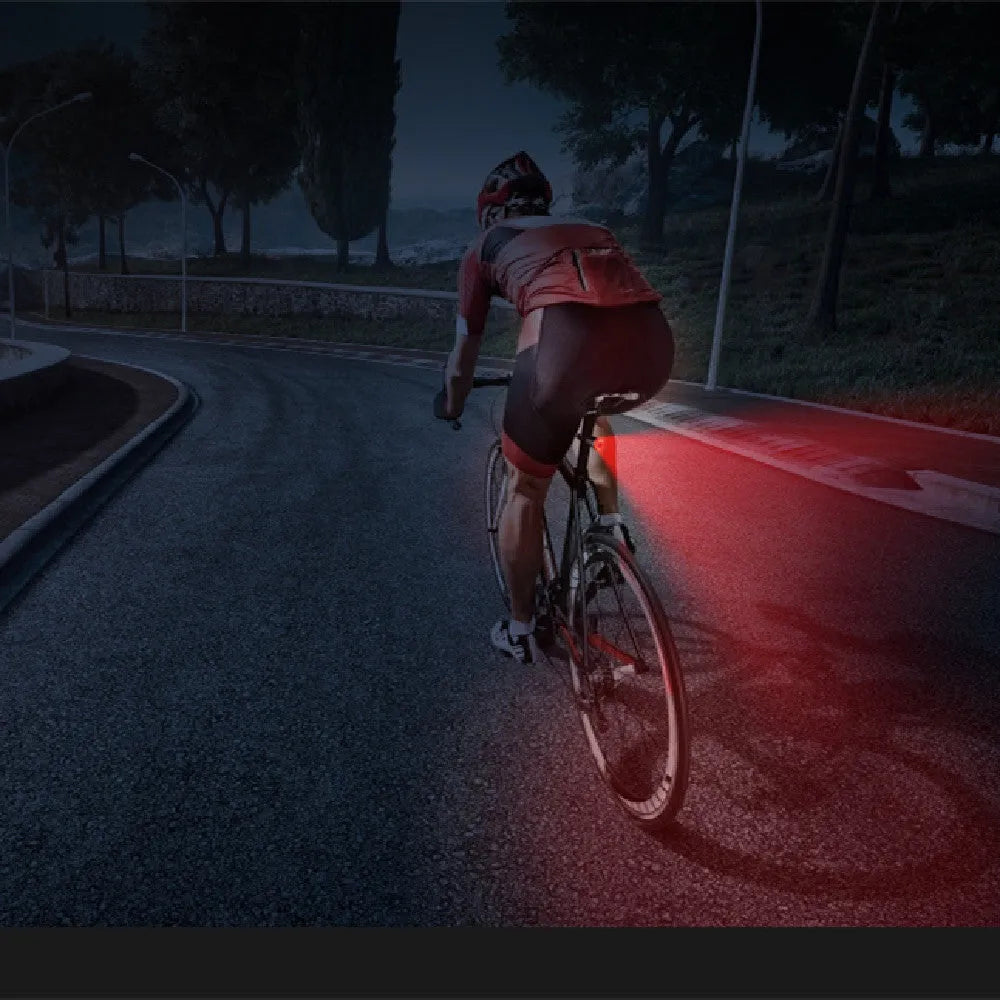 Black aluminium alloy smart brake sensing USB rechargeable bicycle taillight showing compact design.