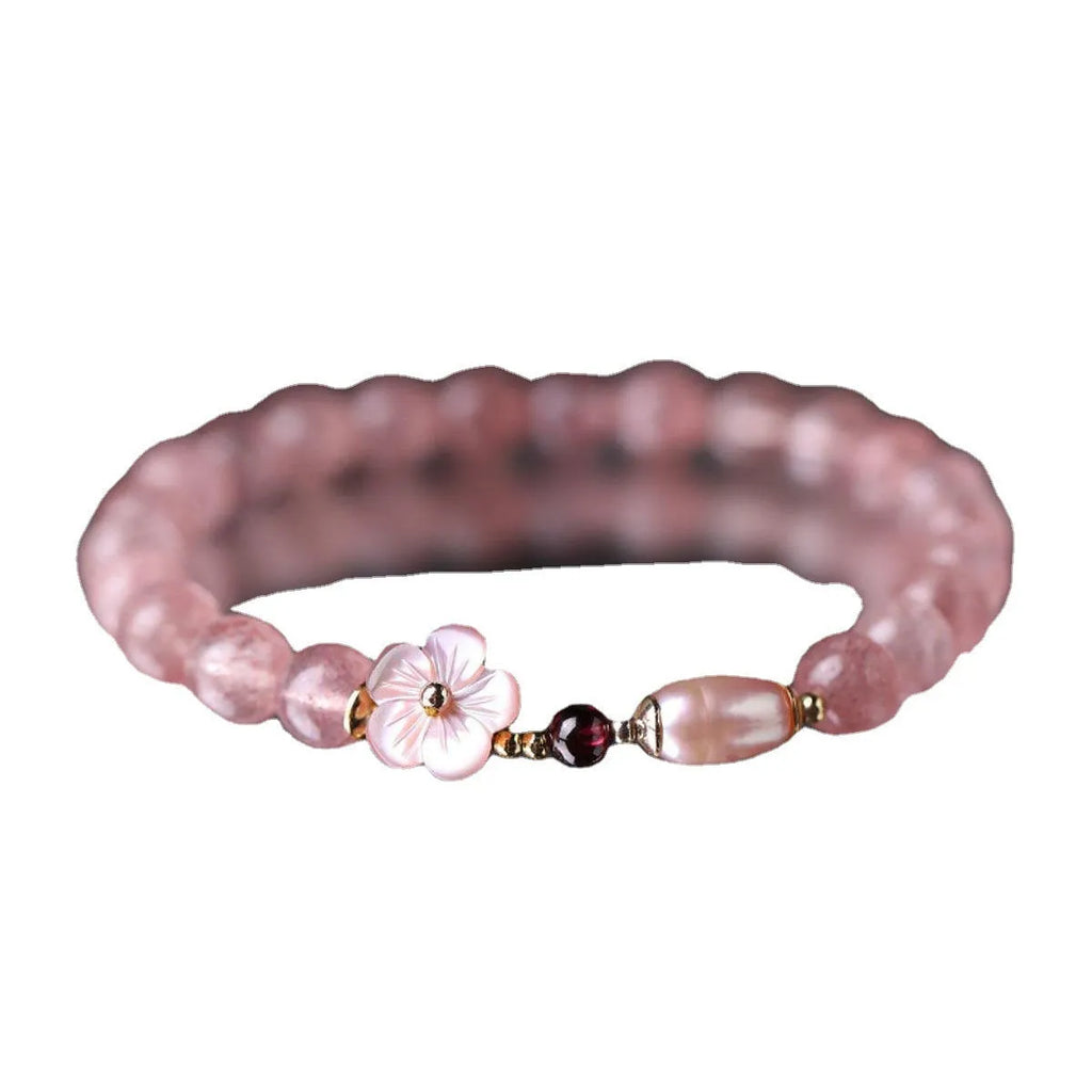 Strawberry quartz crystal flower bracelet with adjustable fastening on wrist