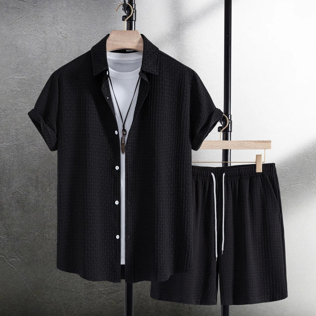 Men's loose cotton blend beach suit with short sleeve cardigan shirt and shorts in black.