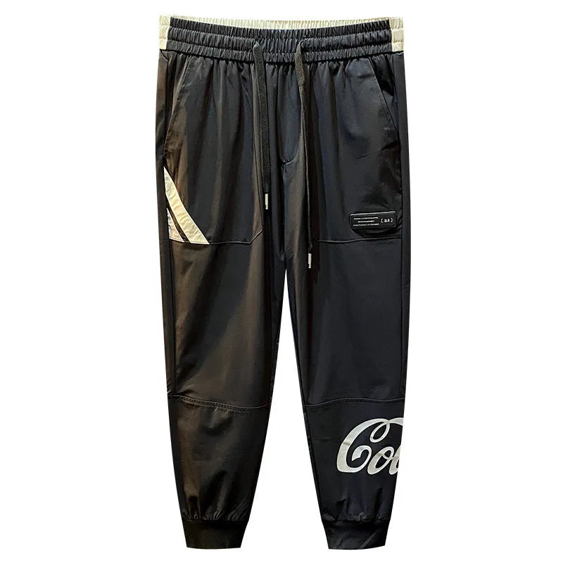 Men's solid black ultra-thin ice silk cotton trousers with a cropped leg and elasticated ankle band.