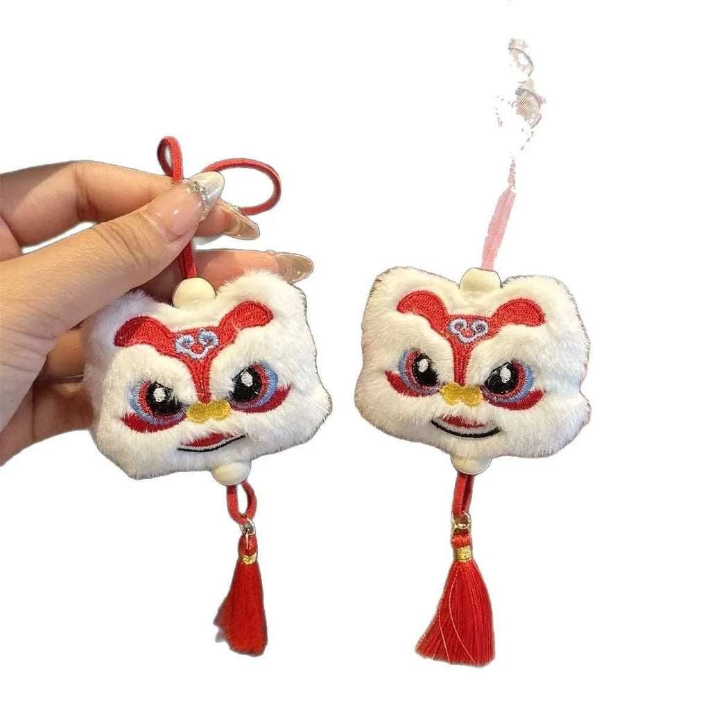 Blue handmade plush lion tassel keychain ornament with star stone detail