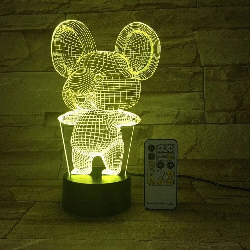Koala-shaped LED night light showing seven colour options on black base with touch or remote control