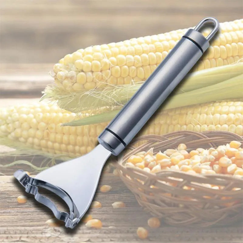 Stainless steel corn planer with silver finish on a kitchen surface measuring 18cm long