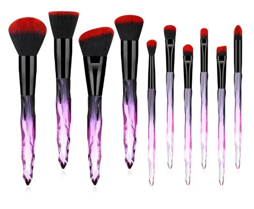 Ten clear crystal-handled foundation brushes with artificial fibre bristles in black, blue, red, and yellow colours