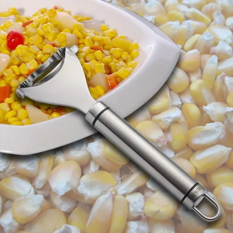 Stainless steel corn planer with silver finish on a kitchen surface measuring 18cm long