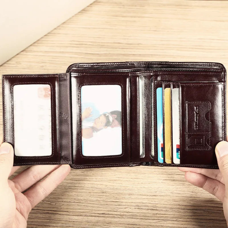 Men's leather wallet open showing photo window, card slots, coin pocket, and banknote compartment.