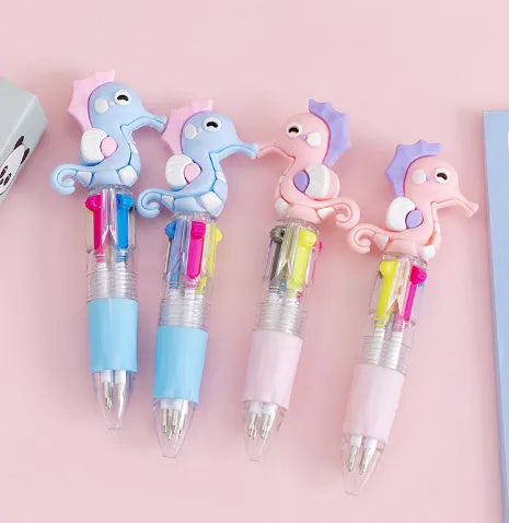 Cartoon-themed four colour press ballpoint pen with plastic and silicone body and 0.7mm tip.