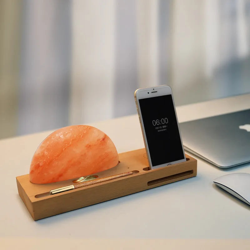 Sunrise Oriental wooden base table lamp with natural salt block shade and integrated wireless phone charging pad.