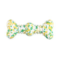 Natural rubber dog chew toy with camouflage pattern, shown in green, white, and yellow, bone-shaped for medium and large breed dogs.