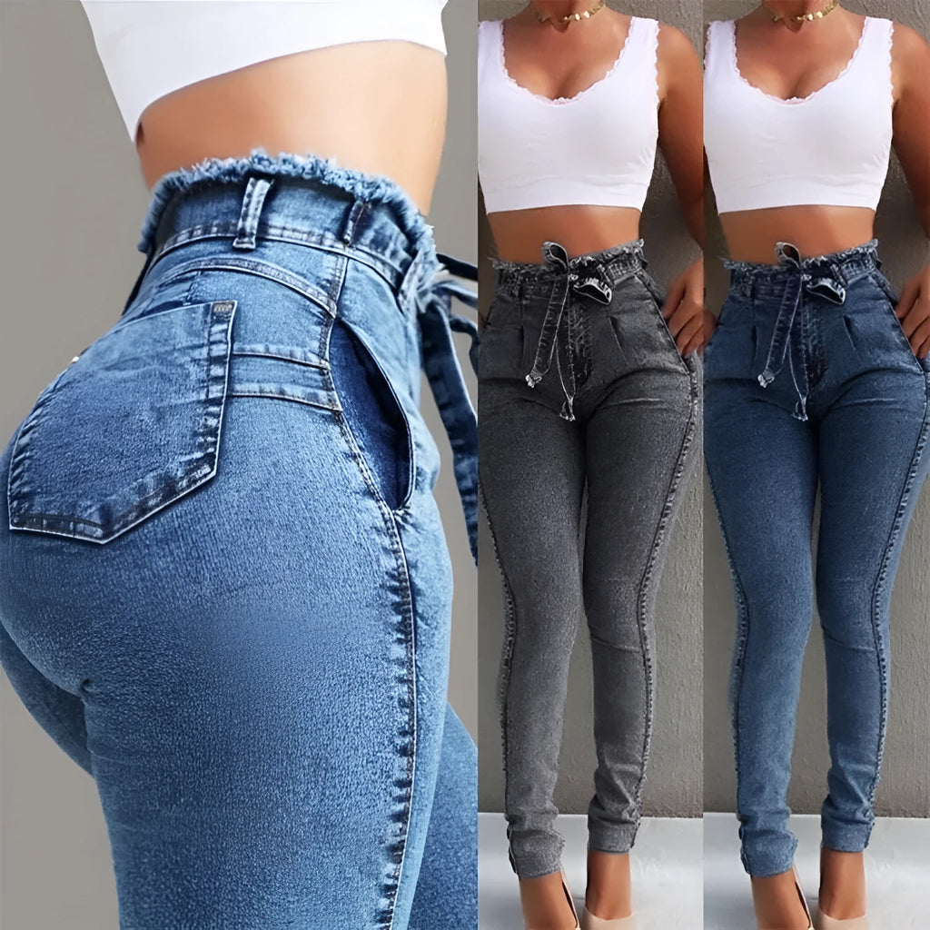 A pair of dark blue fringed jeans made from cowboy denim on a mannequin