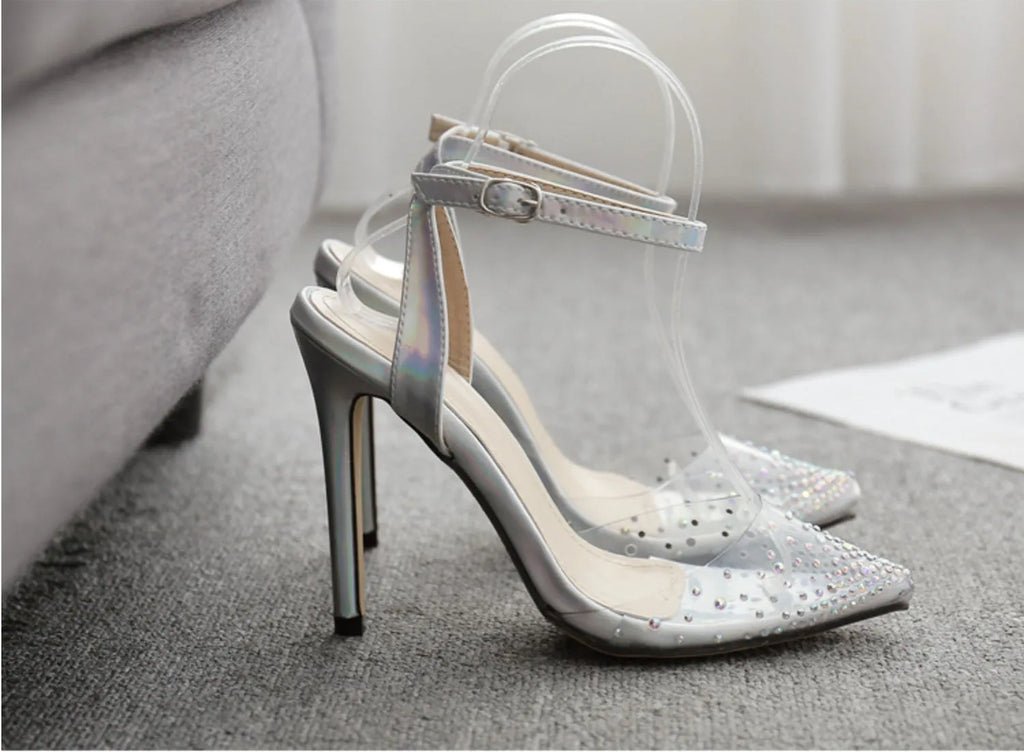 Women's pointed toe stiletto sandals with crystal diamond embellishment on the PVC upper.