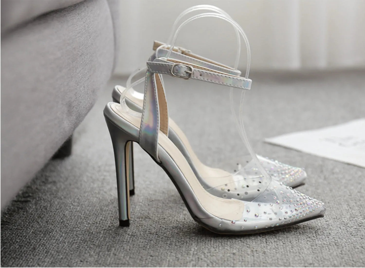 Women's pointed toe stiletto sandals with crystal diamond embellishment on the PVC upper.