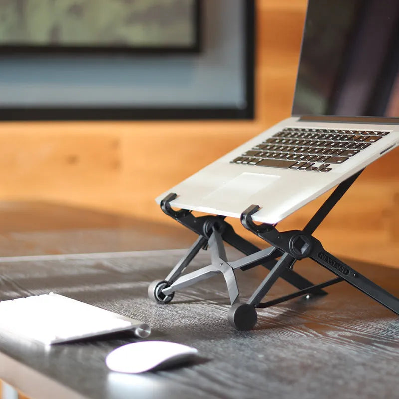 Black folding laptop stand with 360° rotating base shown in open and closed positions