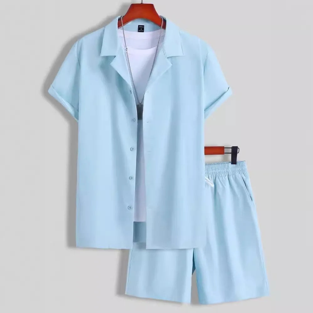 Man wearing a light blue short sleeve Cuban collar shirt and matching shorts from a men's sport suit set.