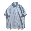 Blue striped loose-fit overalls shirt with short sleeves and cardigan style