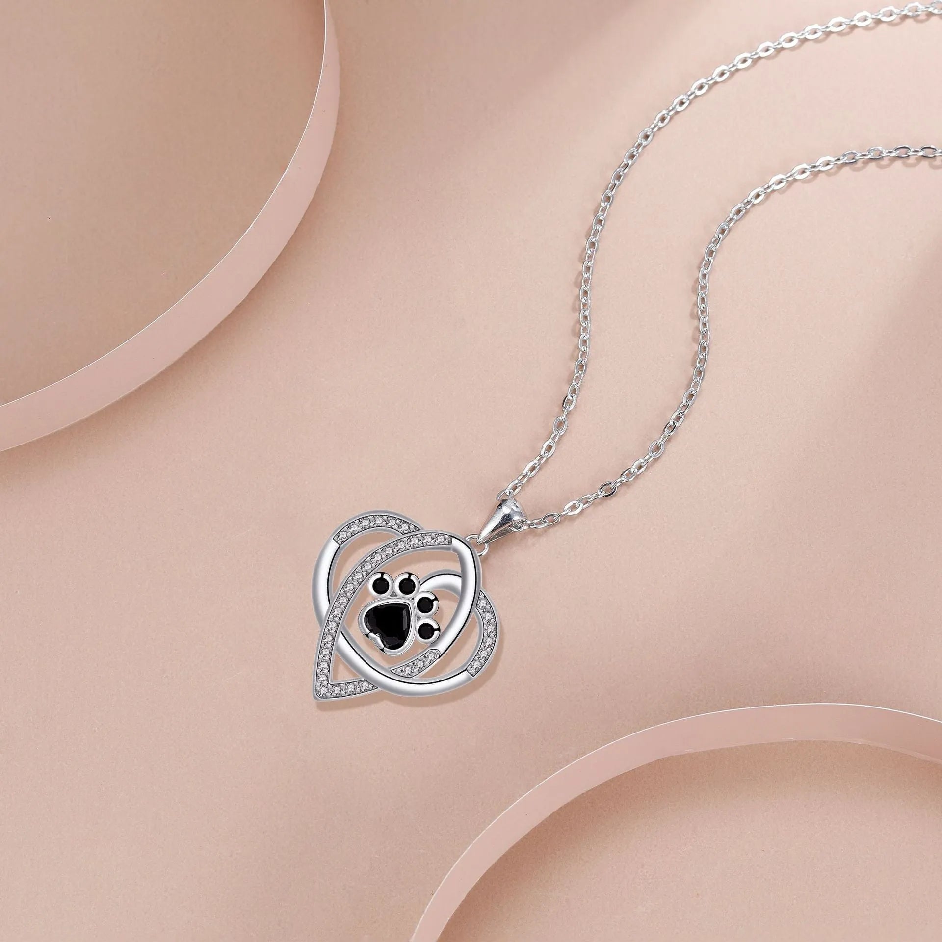Copper pendant necklace with dogs and cats paw print design on cross chain