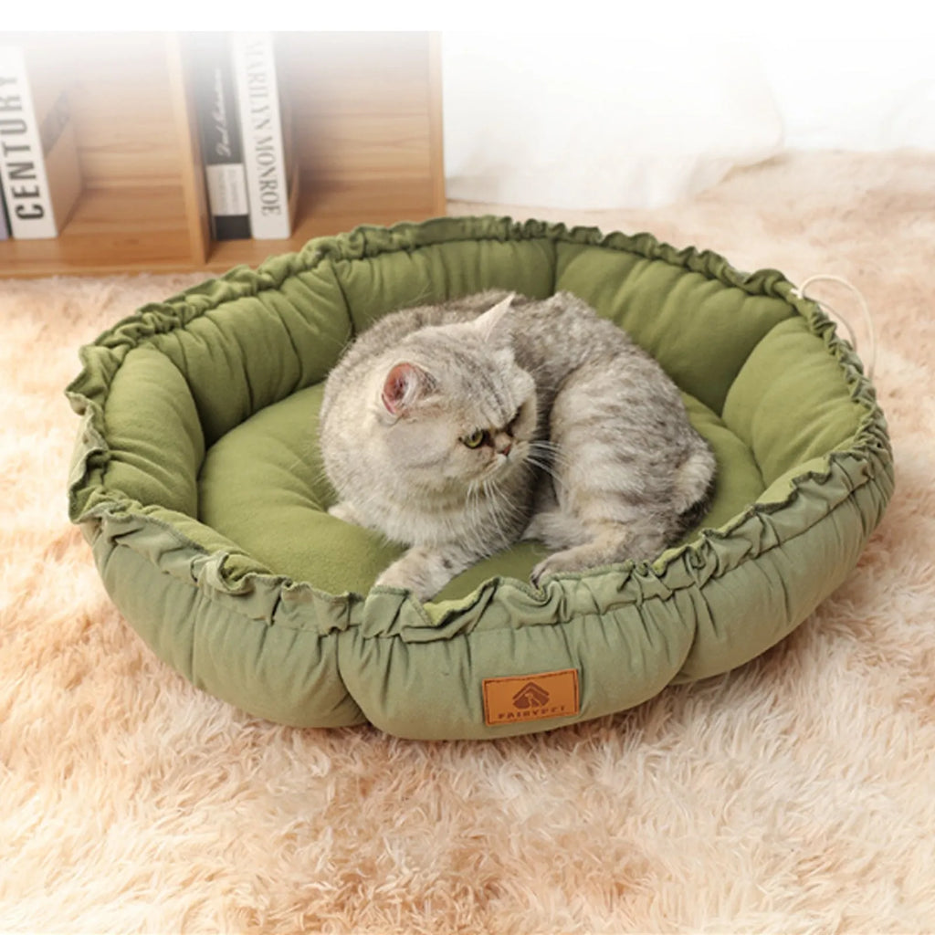 Reversible grey donut cat bed shown in both raised and flat configurations