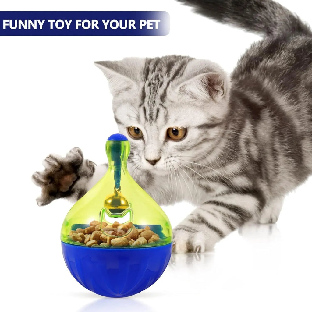 Light grey interactive pet treat dispenser ball with tumbler shape on a wooden floor.
