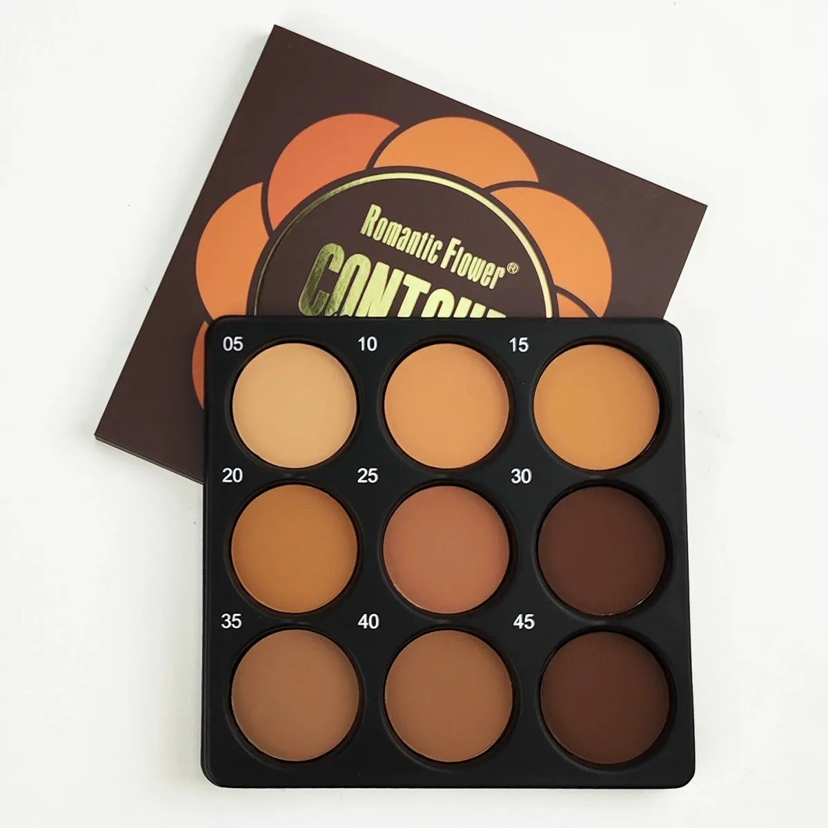 Open 9-colour dark matte eyeshadow palette with repair disk, for punk and fashion makeup styles.