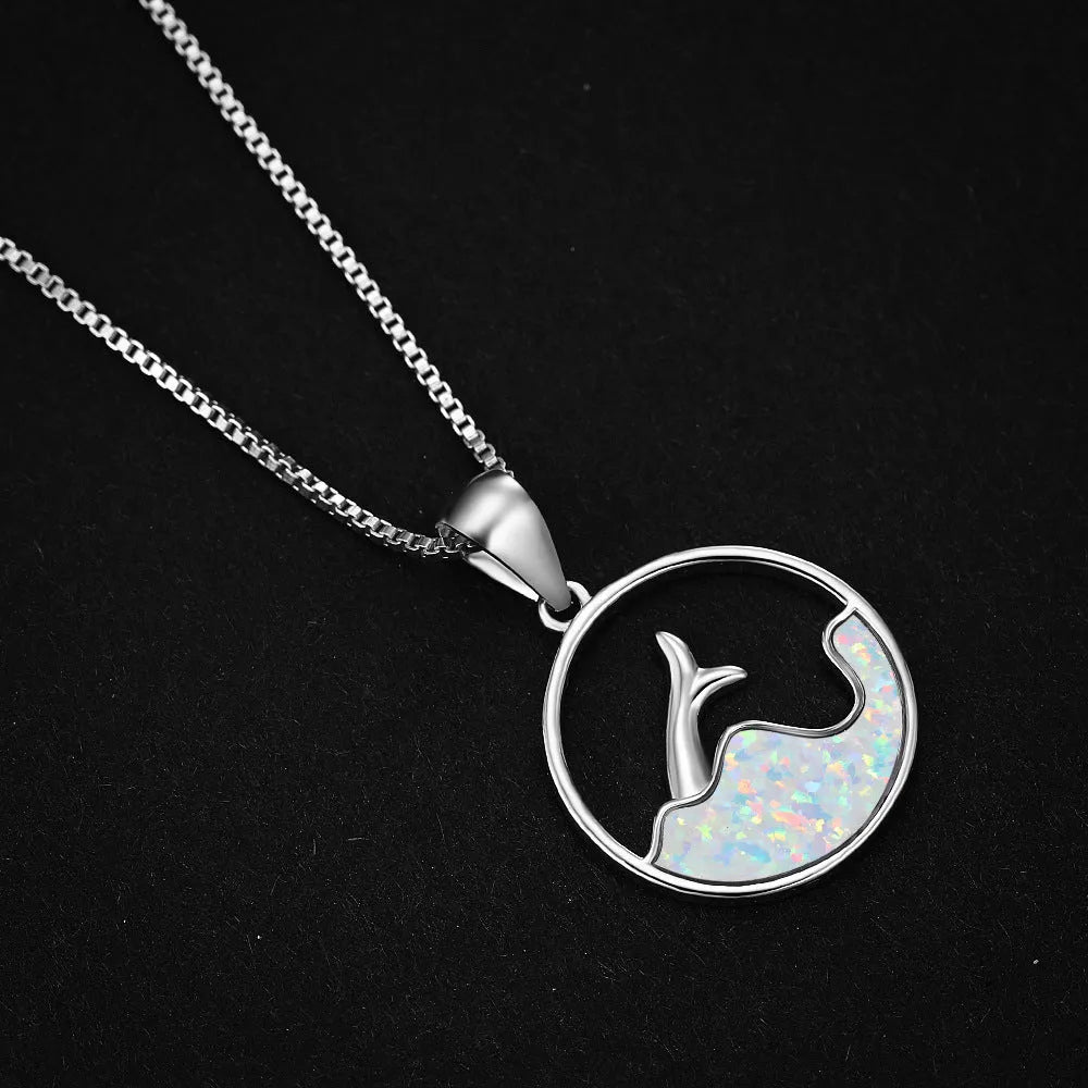 Geometric fishtail pendant necklace with electroplated white gold finish and round decorative elements
