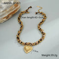 Stainless steel necklace with geometric leopard and heart pendant on adjustable chain