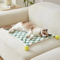 Plush fleece pet blanket with plaid pattern and fur ball decoration for cats and dogs