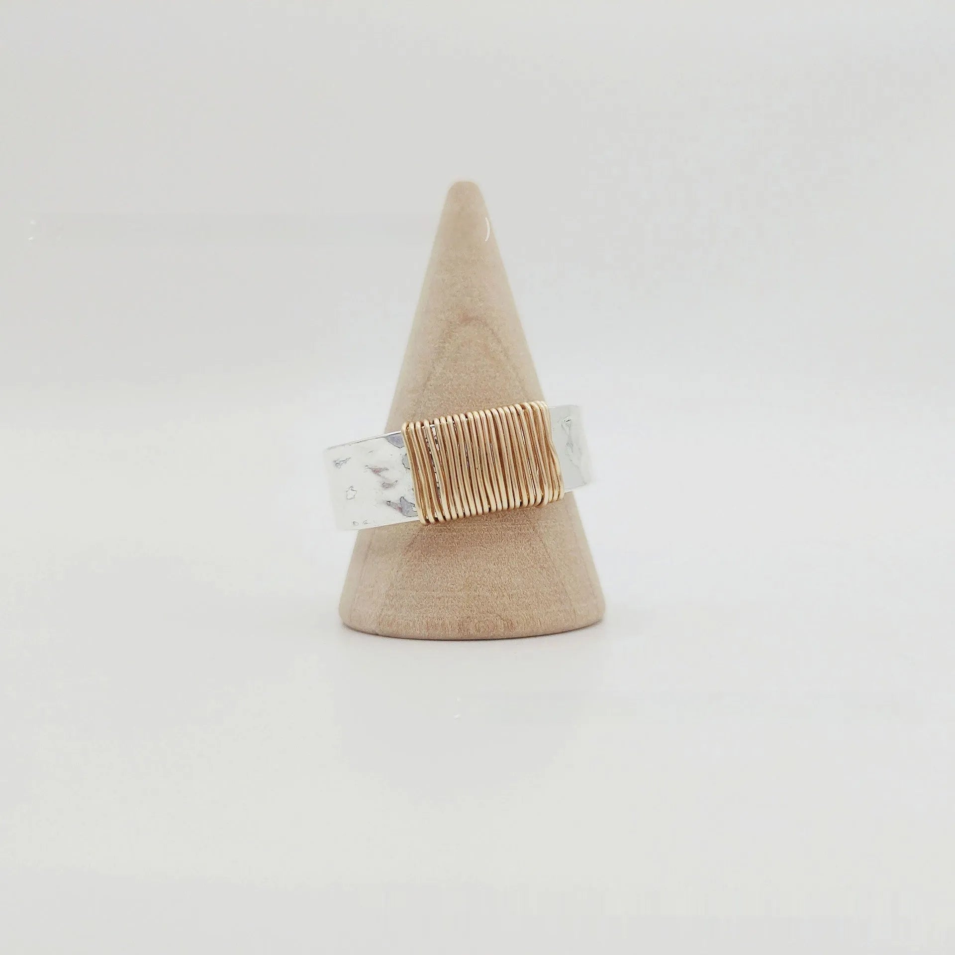 Copper geometric simple bracelet with silver gold coil finish and wide ring design.