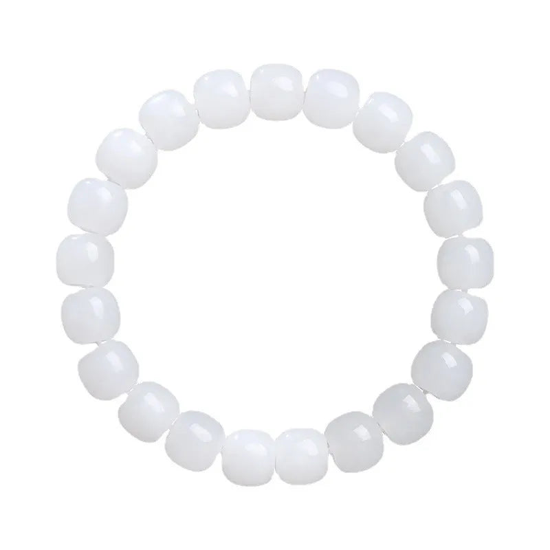 White Hetian jade barrel bead bracelet showing three bead size options on wrist