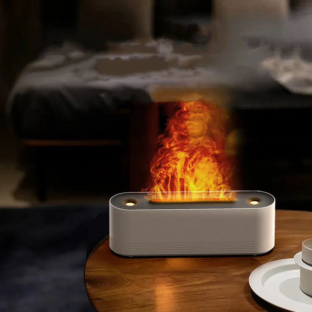 Black Flame Air Ultrasonic Humidifier emitting cool mist with a multi-colour LED flame light effect on a wooden table.