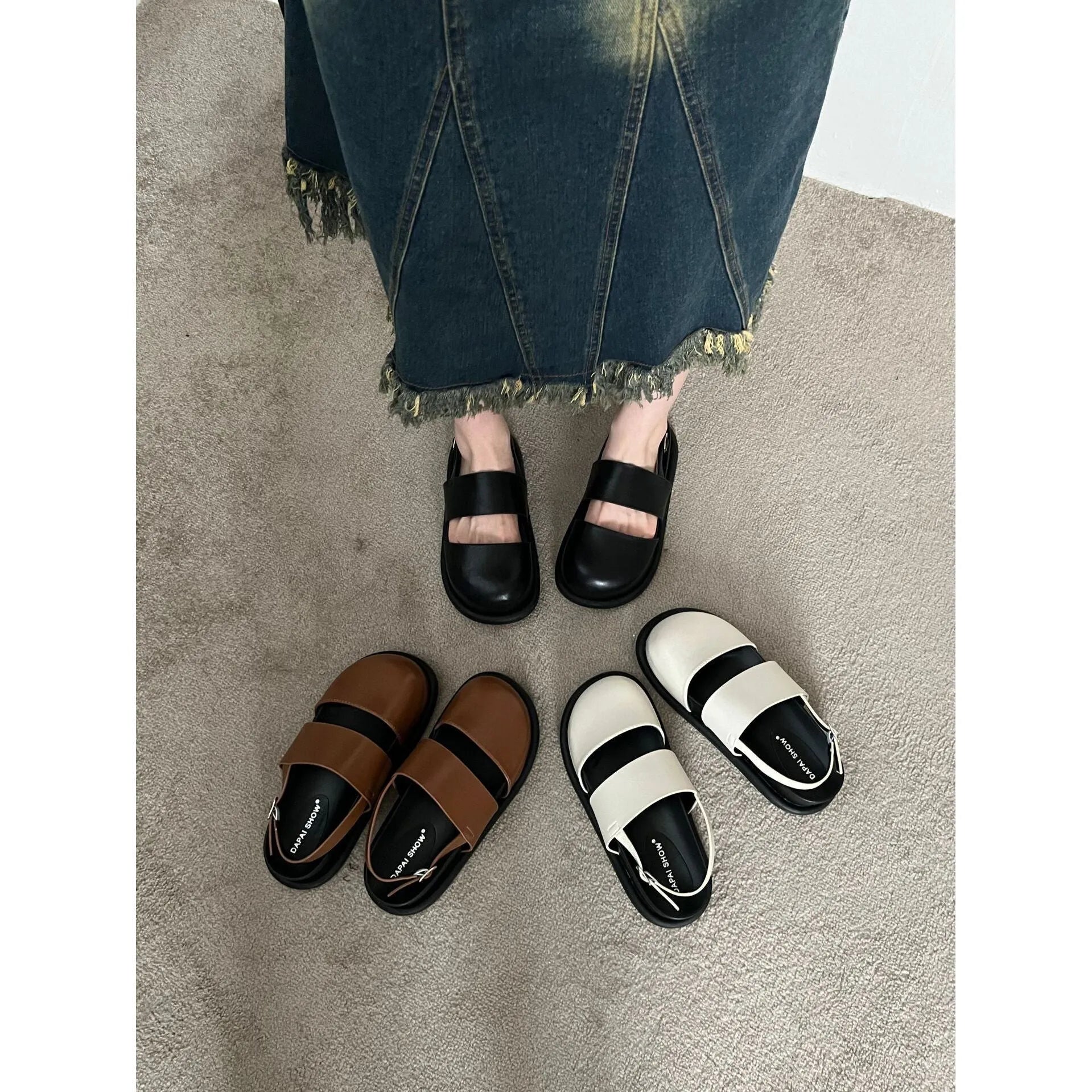 Retro closed toe sandals with an ankle buckle in apricot colour on a white background