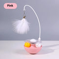 Cat interactive tumbler toy with feather wand and catnip ball on floor for kitten exercise
