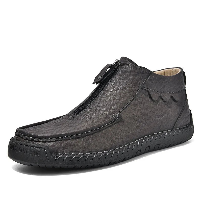 Men's black slip-on leather loafers with a round toe and visible stitching on a sewn rubber sole.