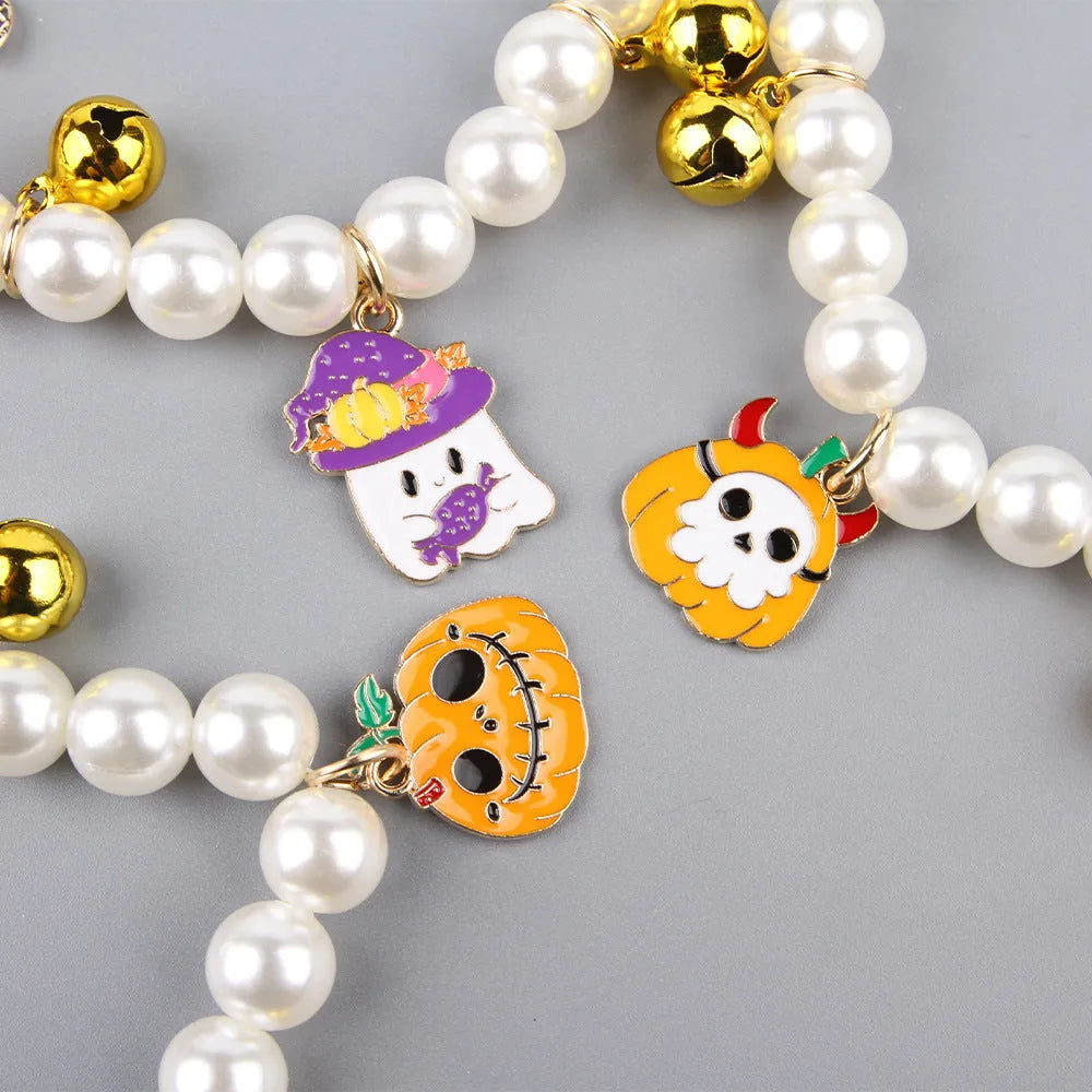 Halloween-themed cat collar with simulated pearl beading showing purple ghost pumpkin design.