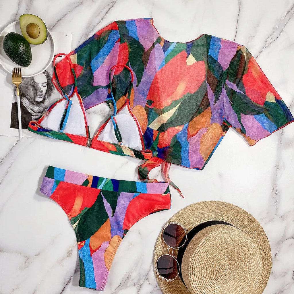 Red women's printed split design swimsuit or bikini made from nylon fabric.
