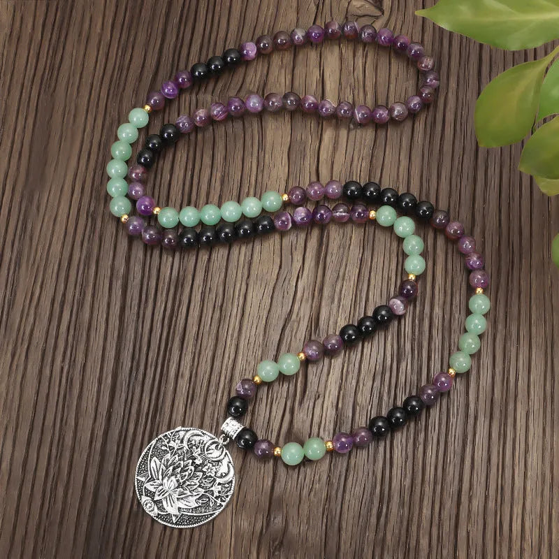 Handmade geometric lotus pendant necklace with stone bead chain and matching bracelet.