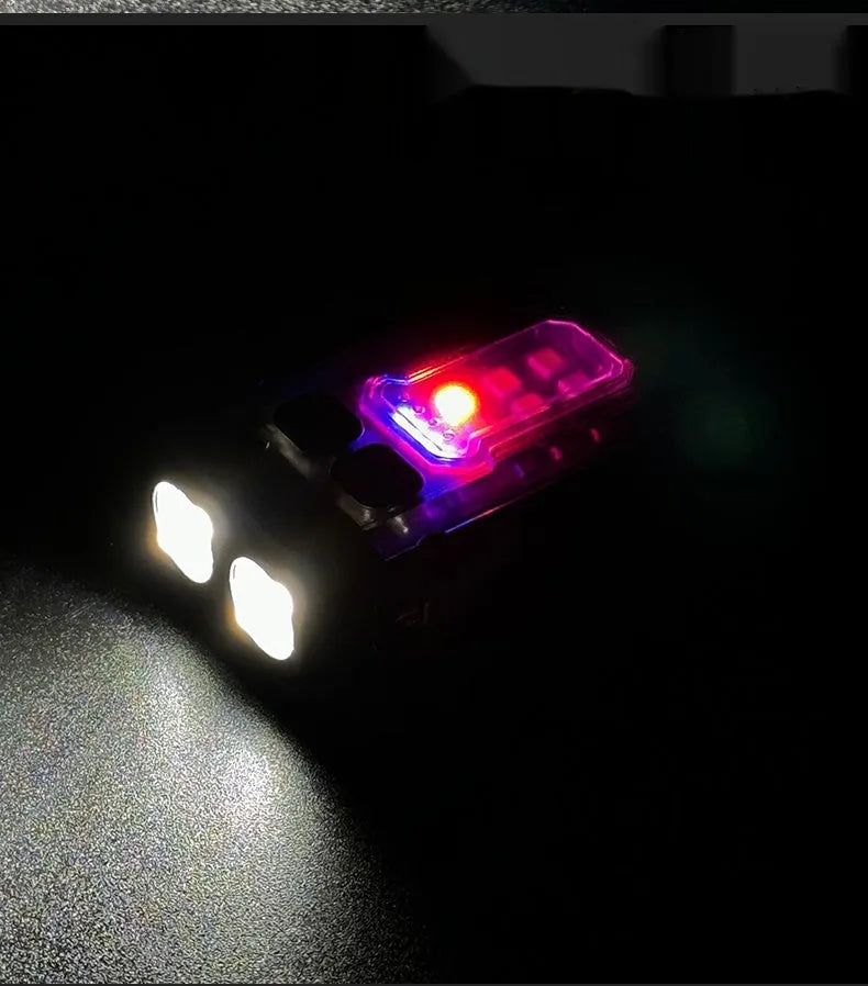 Compact black tactical warning flashlight with a USB charging cable and a clip for backpack mounting.