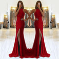 Red long knit evening dress with large swing skirt, high waist, and hollow neck detail on a mannequin.