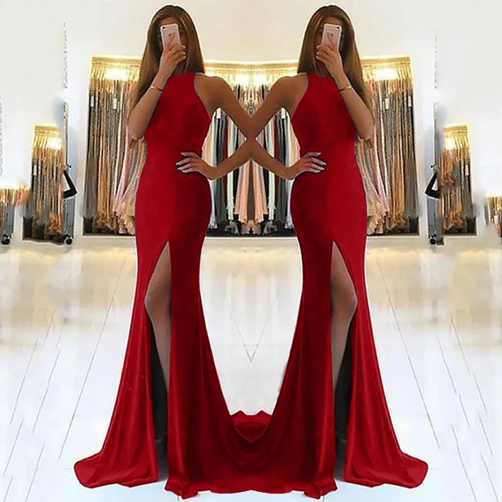 Red long knit evening dress with large swing skirt, high waist, and hollow neck detail on a mannequin.