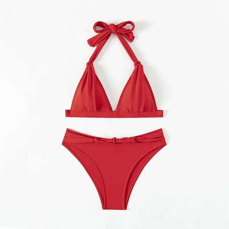 Red women's halterneck bikini with lace-up front closure and adjustable tie sides