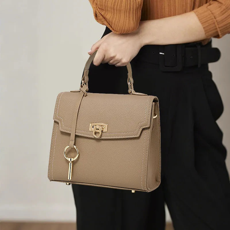 Elephant grey vintage handbag with lock closure and textured litchi pattern leather